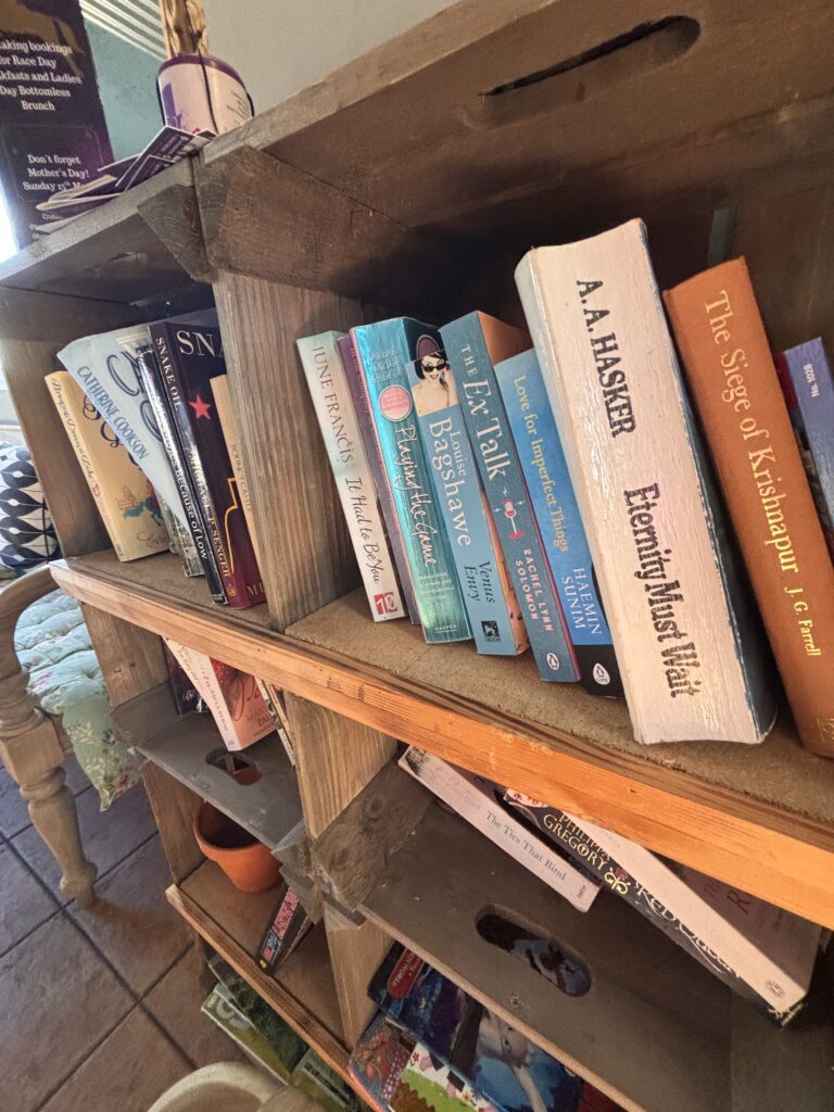 Cosy book corner with a selection of books for customers to enjoy at Browns restaurant