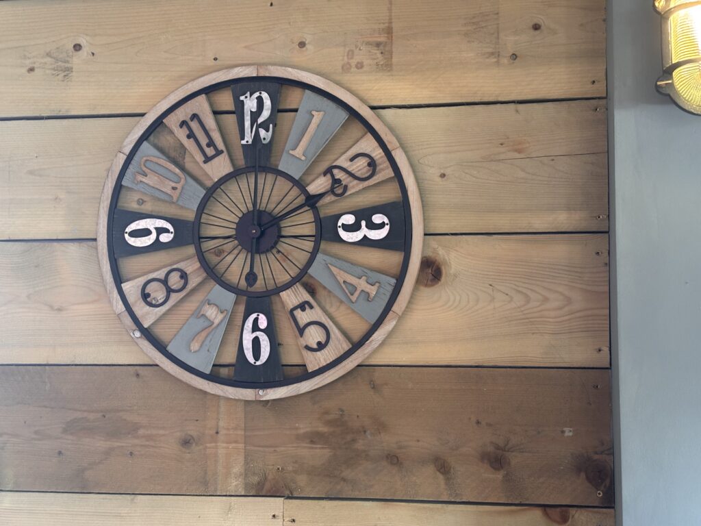 Wooden clock display inside Tewkesbury Garden Centre